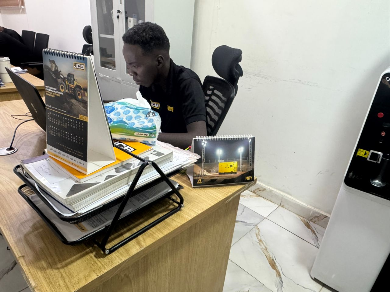 Team member with JCB equipment